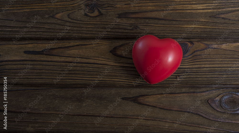 red heart donor on a wooden background. With space for text of your design, advertising
