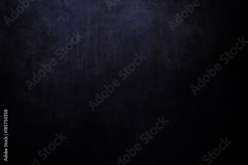black and blue grungy background with spotlight background