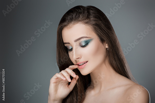 beautiful woman with green evening make-up