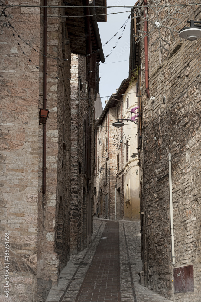 Spectacular traditional italian medieval alley in the historic center of beautiful little town of Spello (Perugia), in Umbria region -  central Italy