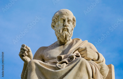 Close-up of a marble statue of the great Greek philosopher Plato on background the sky. 