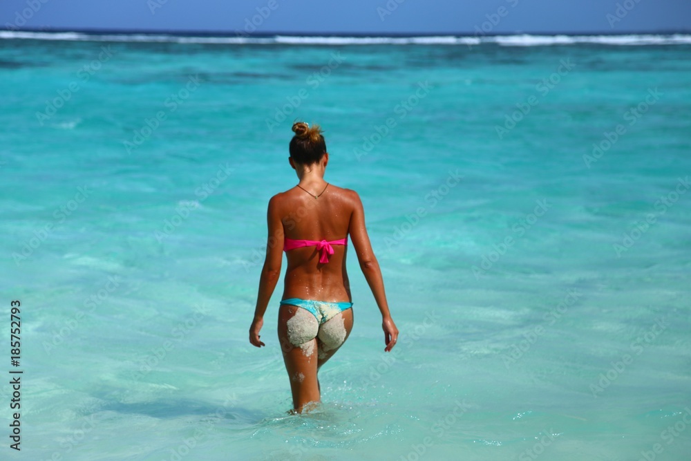 girl in thong on a tropical beach
