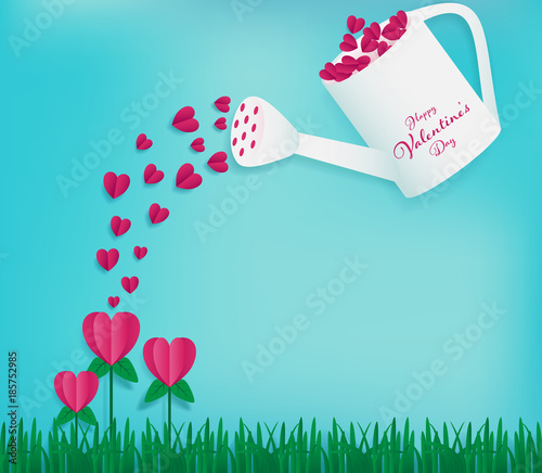 Watering can contains full of red hearts and water on the heart flowers as valentines paper art conception included soft blue sky background ,paper grass on bottom ,happy valentine's day word on can.