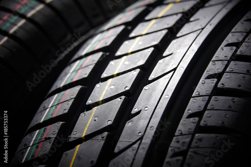 Studio shot of a set of summer car tires on black background. Contrasty lighting photo