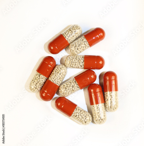 medical capsules with granules of medicine photo
