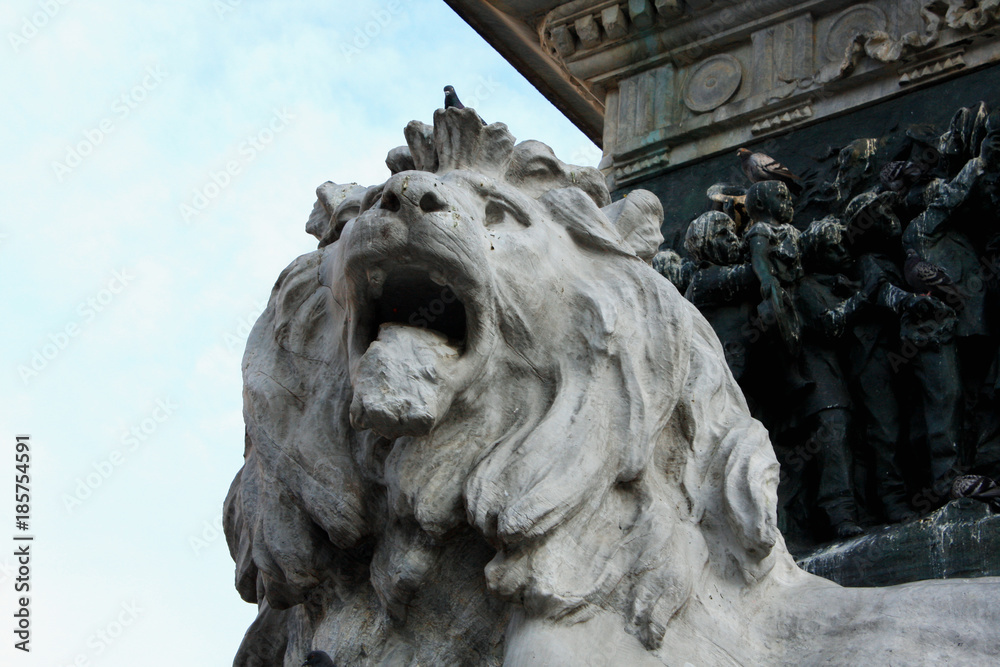 Detail of lion head on the Monument to King Victor Emmanuel II at Cathedral Square or Piazza del Duomo in Italian. Milan, Italy.