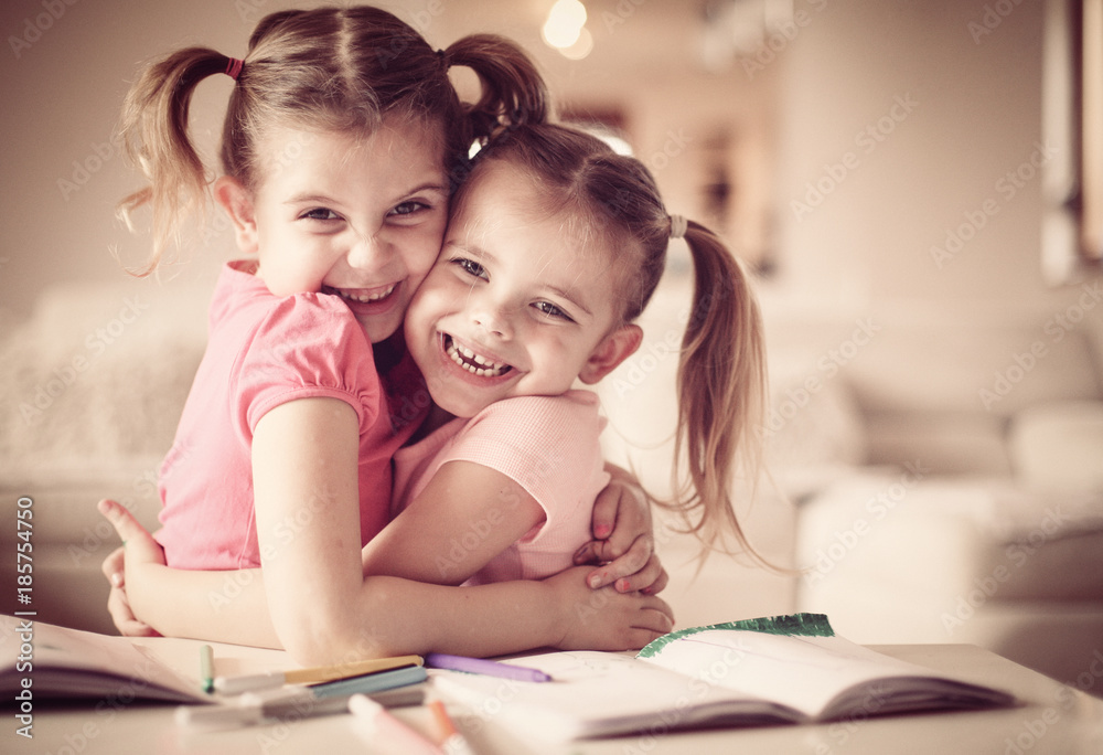 Creative cute girls hugging and looking at the camera. Creative cute girls hugging and looking at the camera.