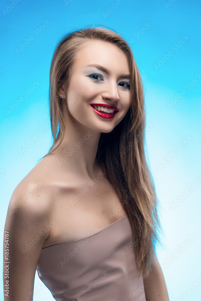 Portrait of the beautiful smiling blonde girl with red lips and red manicure. Portrait of the beautiful smiling blonde girl with red lips and red manicure.