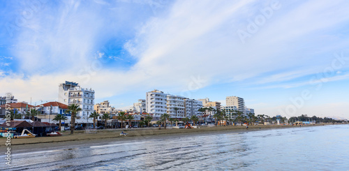 Finikoudes beach, city of Larnaca, Cyprus. Blue sky with few clouds background.