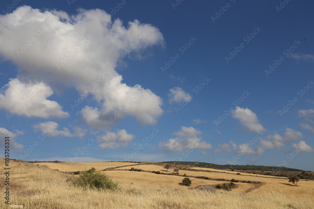 View of Cyprus mountains and beautiful sunny sky with clouds View of Cyprus mountains and beautiful sunny sky with clouds