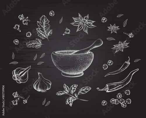 spices, herbs and mortar. Background black Board