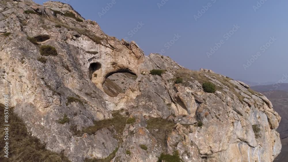Flying around a rock with a hole