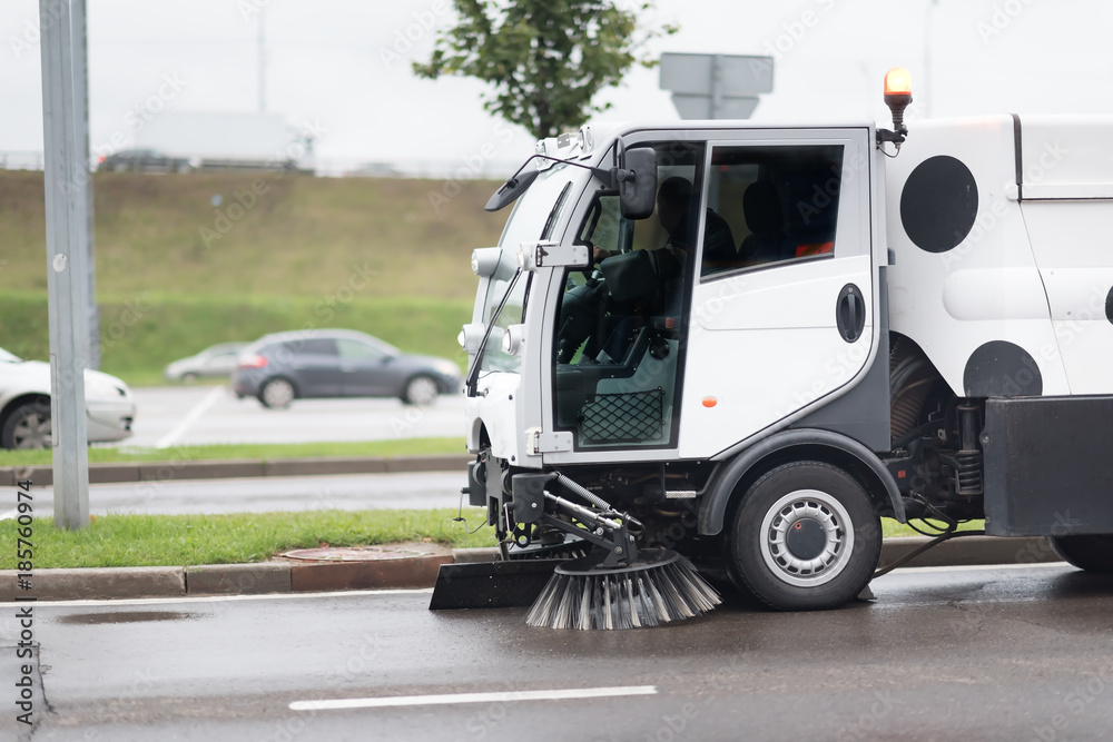 A street sweeper machine cleaning the streets.