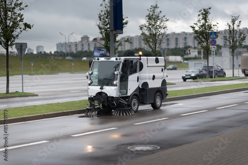 A street sweeper machine cleaning the streets. photo