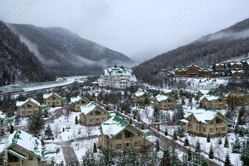 Cozy houses in snowy mountains. Krasnaya Polyana