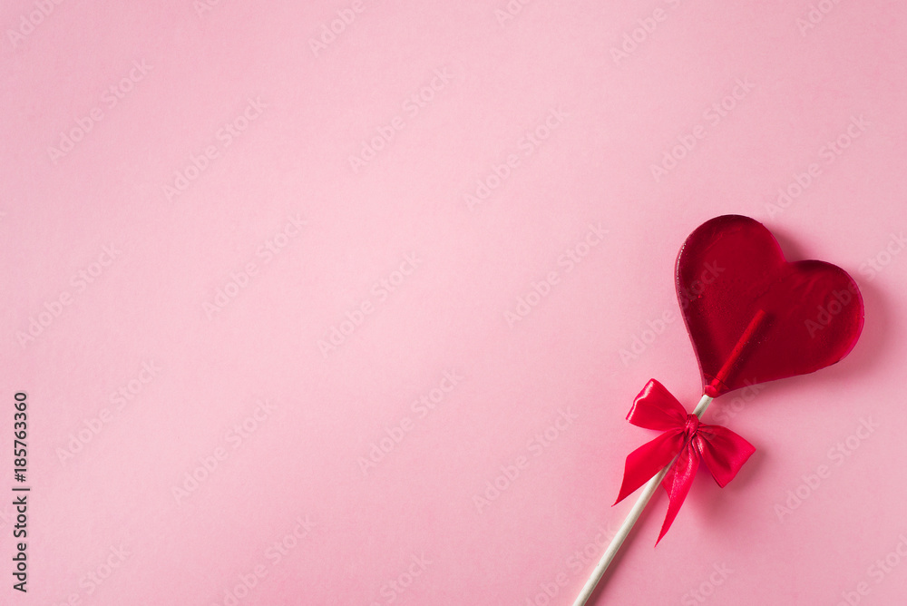 Valentines and birthday card with lollipop or candy on pink background Valentines and birthday card with lollipop or candy on pink background