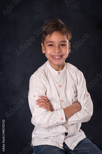 portrait of the schoolboy of the brunette in a white shirt