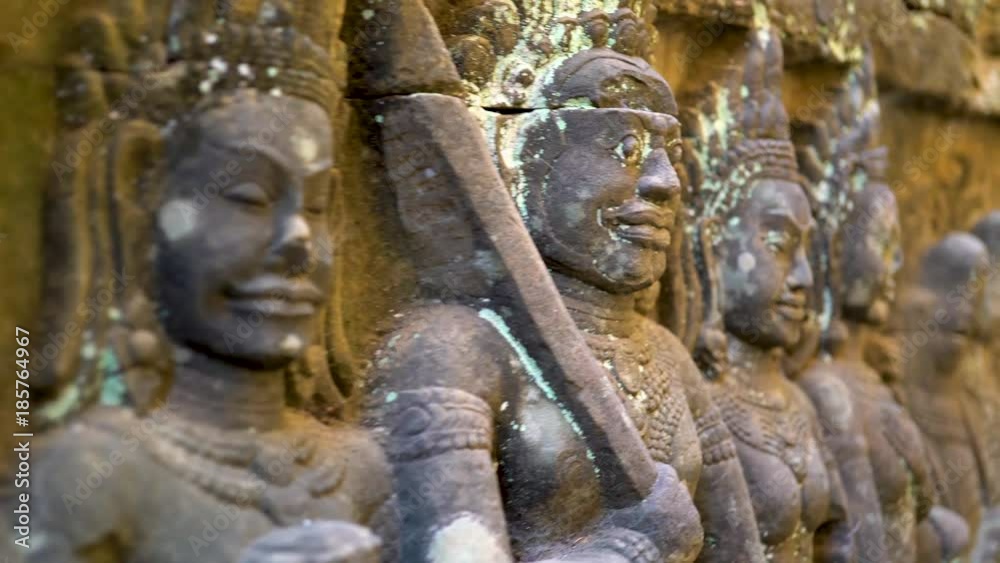 Extreme closeup steadicam motion through the Terrace of the Elephants meandering walkway with bas relief sculptures. Extreme closeup steadicam motion through the Terrace of the Elephants meandering walkway with bas relief sculptures.