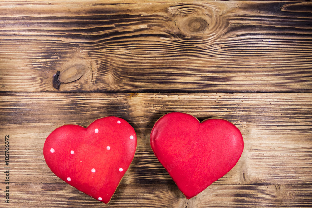 Heart shaped cookies for valentine day on wooden table. Top view Heart shaped cookies for valentine day on wooden table. Top view