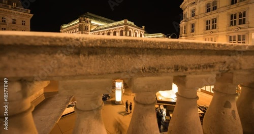 VIENNA, AUSTRIA – DECEMBER 2015 : Moving timelapse of Vienna State Opera House on slider at night 