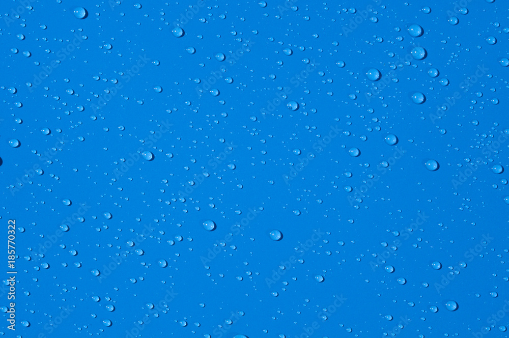 Texture of water drops on a blue background