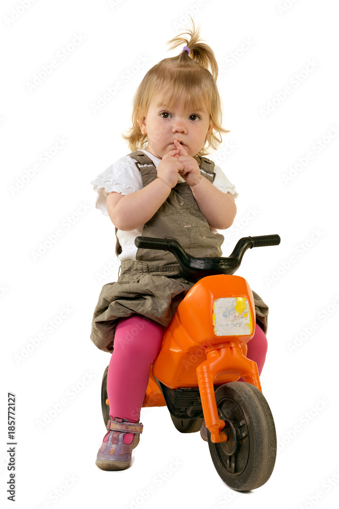 Portrait of a sweet little girl riding a motorbike Portrait of a sweet little girl riding a motorbike