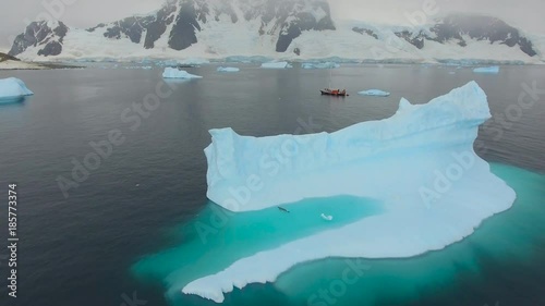 Yacht against the background of the Antarctic coast. Andreev.