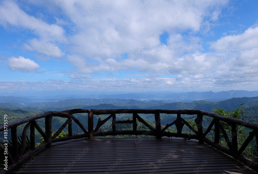 Beautiful mountain landscape, with mountain peaks covered with forest and a cloudy sky