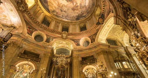 VIENNA, AUSTRIA – DECEMBER 2015 : Timelapse of St Peter's Church interior with paintings and people in view