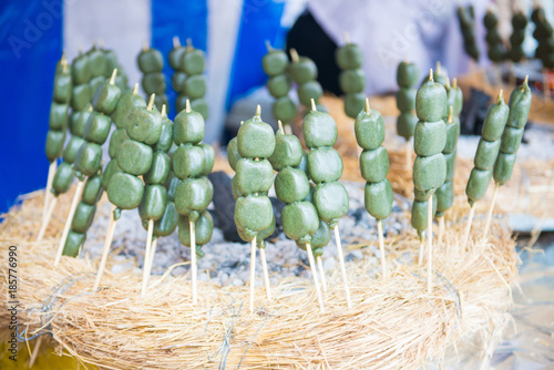 Mitarashi dango ball on skewer, dongo is a local japanese cuisine photo