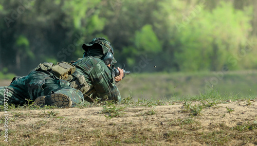 Soldier during a training shooting in shooting gallery