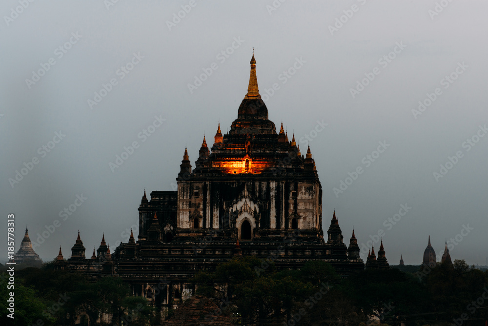 BAGAN, MYANMAR - March 6, 2017: View on Thatbyinnyu temple after sunset