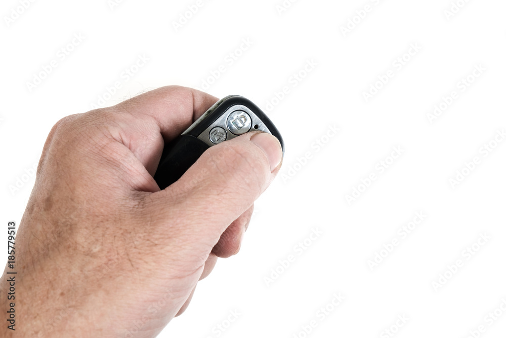 Car remote / Hand holding car remote on white background with copy space. Car remote / Hand holding car remote on white background with copy space.