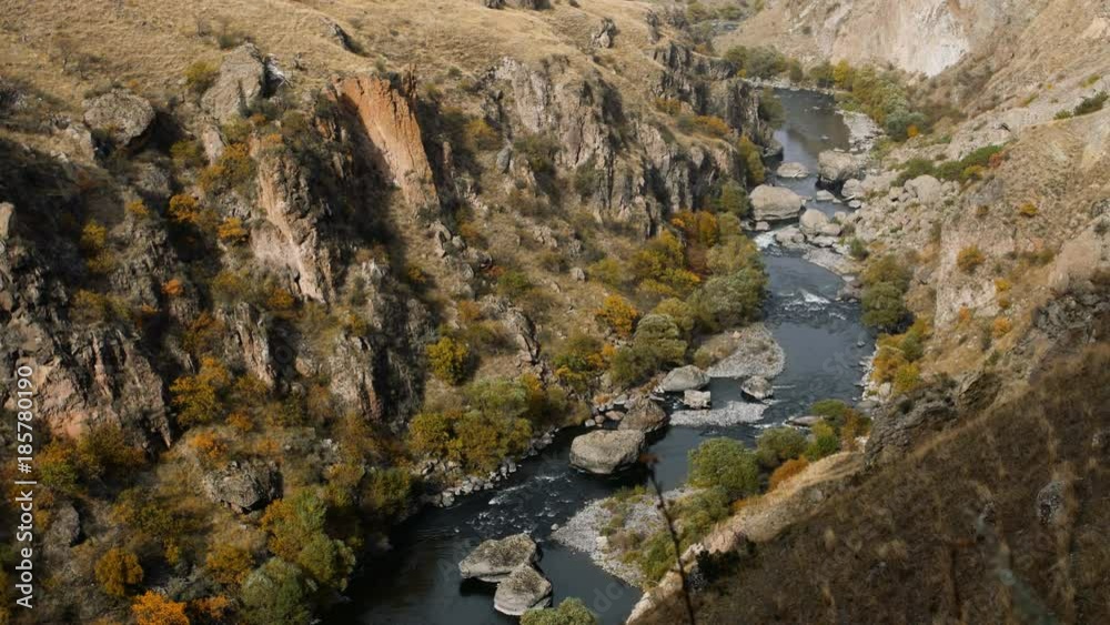 Mountain river flows between huge rocks Mountain river flows between huge rocks