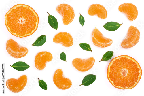 lobules of mandarin or tangerine with leaves isolated on white background. Flat lay, top view. Fruit composition