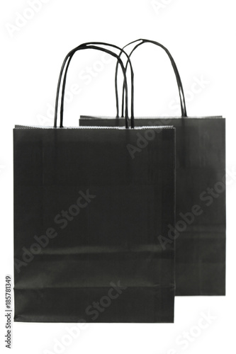 Black shopping bag. black package isolated on white background. Mockup of black paper bag with copy space 