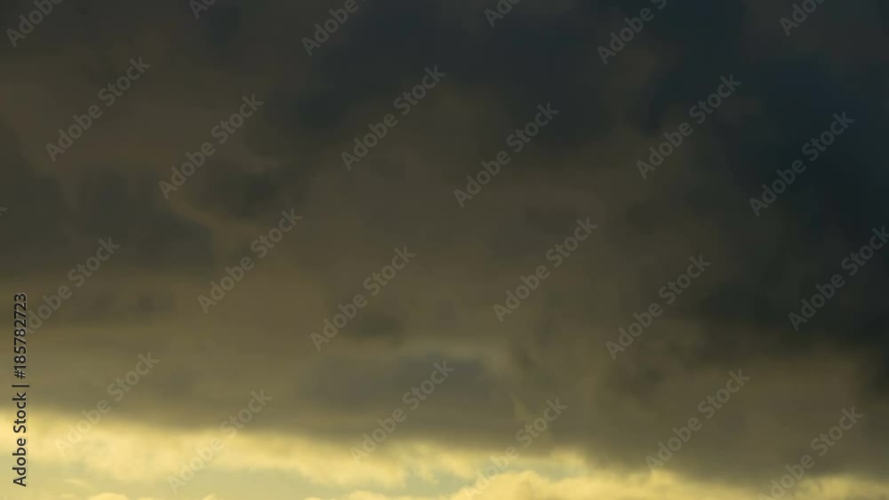 Dark and dramatic storm cloud area background. Time Lapse. Epic storm tropical clouds at sunset. Timelapse 4K UHD. Dark and dramatic storm cloud area background. Time Lapse. Epic storm tropical clouds at sunset. Timelapse 4K UHD.
