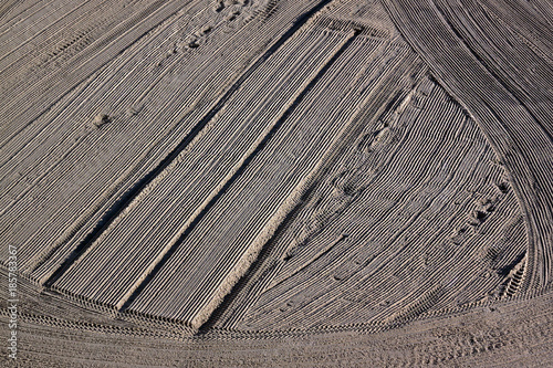 Cleaned by a tractor sand on the Mediterranean beach