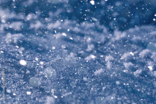 Texture of ice in winter. Pieces of frozen water on a street in 