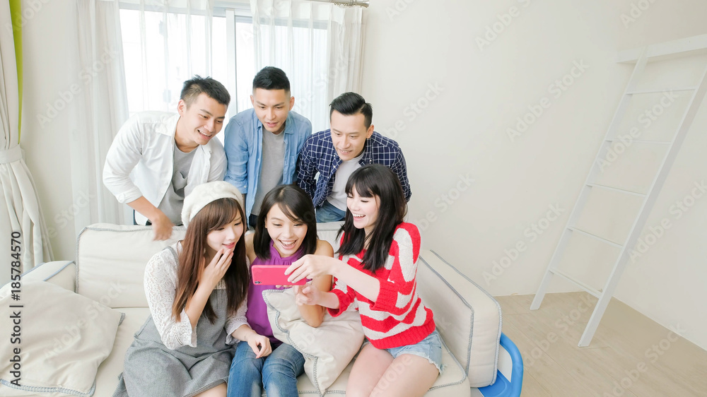young people look phone happily young people look phone happily