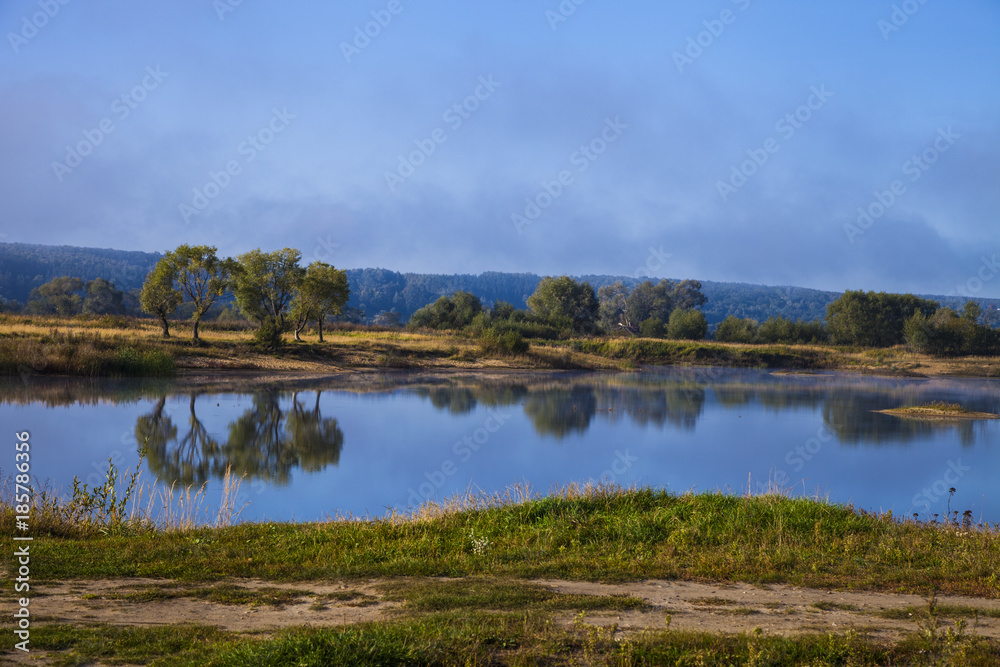 Lake early in the morning with a fog. Lake early in the morning with a fog.