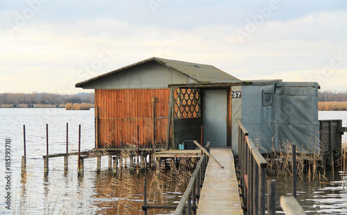 bizzare post-apo looking cottage with narrow catwalk on Hermanicky pond, Czech Republic