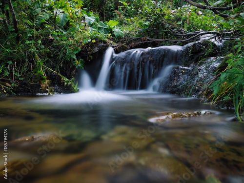 Waterfall at the carpatian mountains green forest © Sergii Mironenko