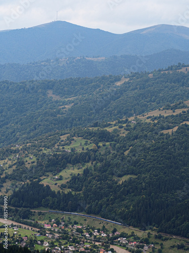 Carpatian mountains village at green forest