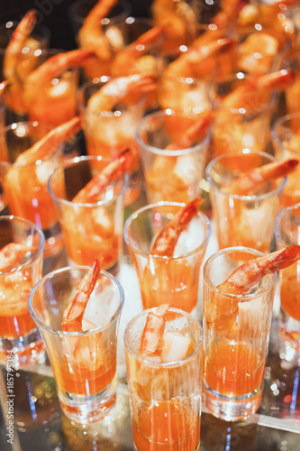 Shrimp cocktail in shot glass shot closeup photo