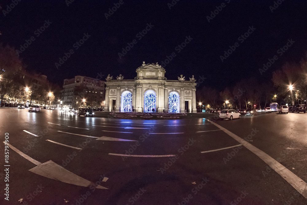 Fototapeta premium Fisheye. Christmas lights in the streets of the Madrid City, Spain. Plaza de Alcala