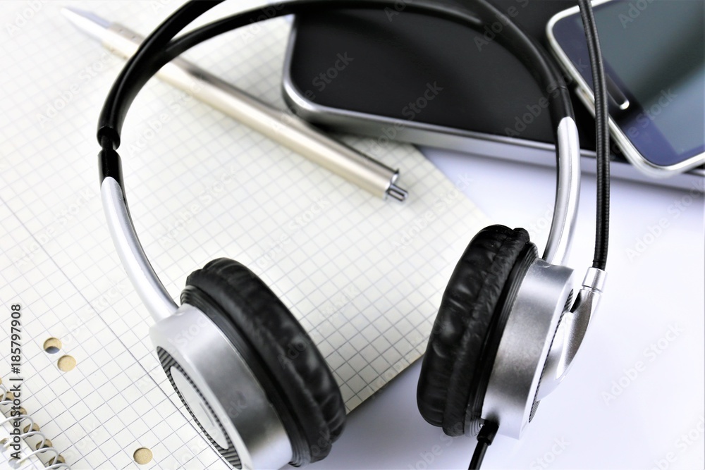 An concept image of a office desk with headset and keyboard An concept image of a office desk with headset and keyboard