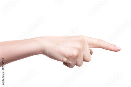 Woman hand pointing at something with index finger isolated on white background