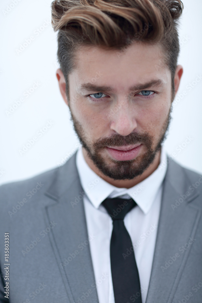 Serious businessman wearing suit and tie. blue background Serious businessman wearing suit and tie. blue background