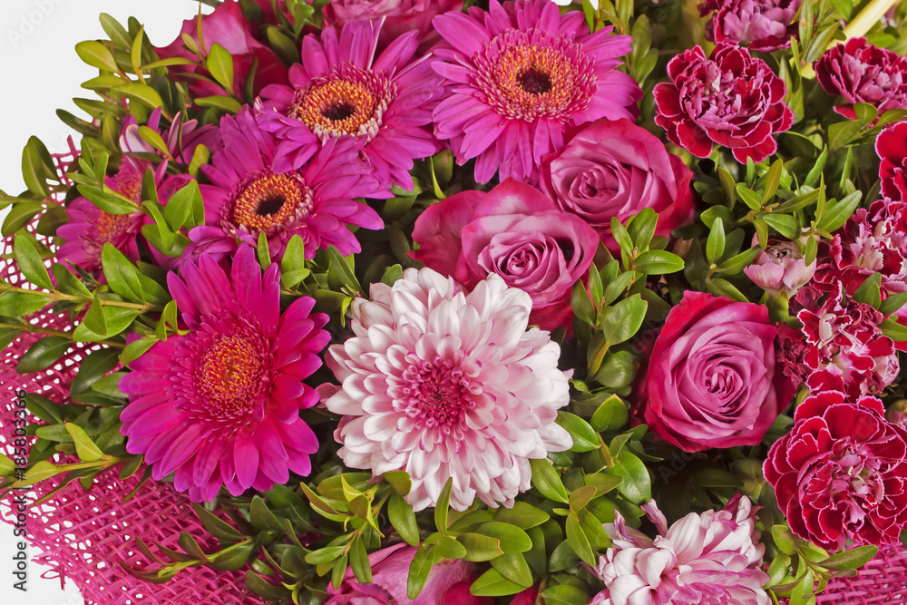 Flower arrangement from pink flowers on white backgrount. Bouquet from various flowers of pink color: gerbera, rose, carnation, dahlia.